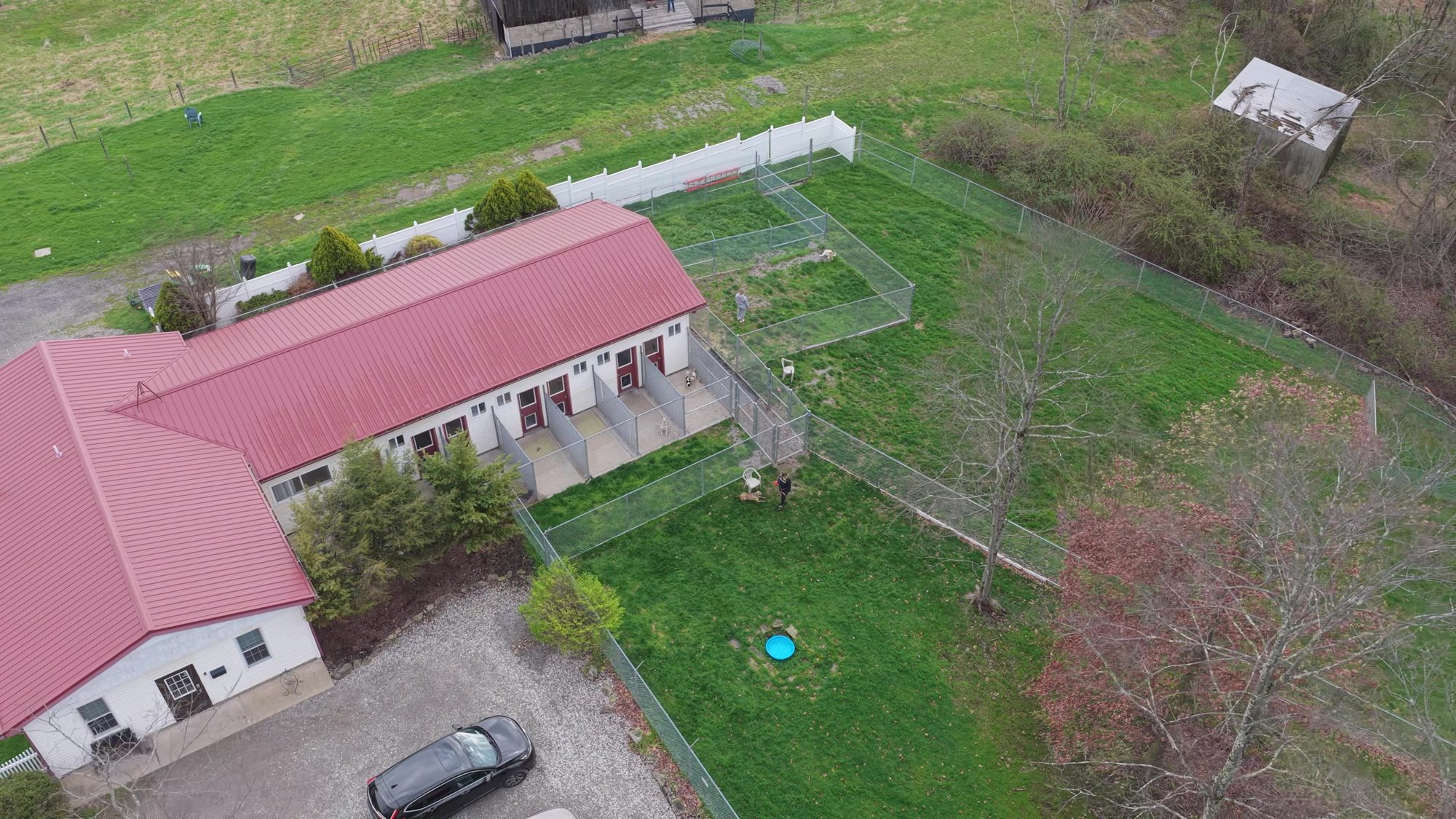 Aerial view of Boujee Barn's private boarding suites, each with its own covered patio